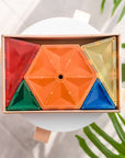 Rainbow Geometry Pack 30 pc displayed in vibrant colors on a white table, showcasing geometric learning fun.