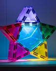 Light Star Pack 28 pc: colorful star-shaped tiles with lights creating a glowing effect in a dark setting.