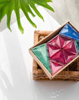 Pastel Geometry Pack 40 pc arranged beautifully in a basket, showcasing colorful shapes and tiles.