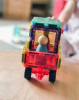 Rainbow Motion Pack 24 pc vehicle with a colorful design, showcasing a wooden figure inside for imaginative play.