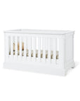 Cot bed 'Emilia' in classy matt white lacquer, featuring elegant detailing and adjustable heights for a stylish nursery.