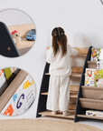 Child using Goodevas 2-in-1 Bookshelf & Toy Storage Unit with books and toys organized.