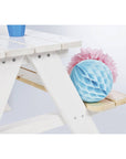 Children's picnic bench 'Nicki' with light blue decorative ball and pink flowers, ideal for outdoor fun and activities.