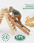Child climbing on the Goodevas Montessori 4-in-1 Pikler Climbing Set made of organic materials.