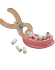 Children's Dentist Set with wooden tools and removable teeth for fun dental role-play.
