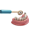 Dentist Set featuring removable teeth and wooden tools for playful dental care exploration.