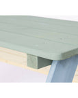 Close-up of the light green tabletop of the Nicki picnic bench, showcasing sturdy solid wood construction.