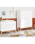 Stylish child's room featuring 'Bridge' large wardrobe and dresser with white lacquered finish and solid ash accents.