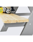 Close-up of the wooden top of the children's picnic bench 'Nicki' with plush toys, highlighting its sturdy design.