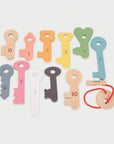 Colorful Rainbow Wooden Keys set including numbers and matching dots for interactive play and learning.