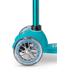Close-up of the wheel on the Mini Micro Deluxe scooter, showcasing its smooth PU design for fun rides.
