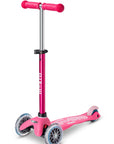 Mini Micro Deluxe scooter in vibrant pink, lightweight design, smooth wheels perfect for young riders.