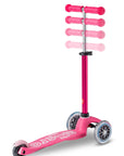 Mini Micro Deluxe pink scooter with adjustable handlebar and smooth wheels for kids, designed for fun and play.