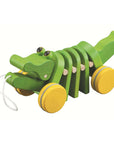 Pull Toy – Alligator in vibrant green, encouraging toddlers to walk and explore with its playful clacking sound.