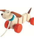 Pull Toy Dachshund Dog with wooden body and fabric ears, perfect for toddlers to pull along and explore.