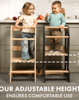 Two children using the Goodevas Montessori Learning Tower in a kitchen, showcasing adjustable heights for safety and comfort.