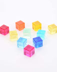 Colorful transparent Tickit Gem Cubes arranged playfully, perfect for building and sensory activities.