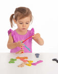 A child engaging with Rainbow Wooden Keys, exploring colors and counting through hands-on play.