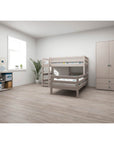 FLEXA Classic grey bunk bed with ladder and safety rail in a bright, spacious children's room.