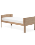 FLEXA Nova Junior Bed, 150x70 cm, Oak, with minimalist design and gently arched headboard for kids' comfort.