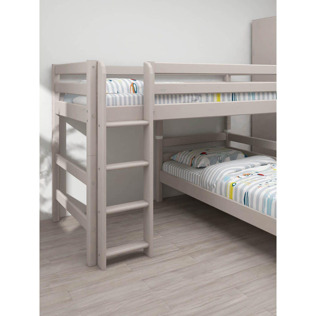 Grey bunk bed with straight ladder and safety rails, designed for children&#39;s rooms, featuring modern striped bedding.