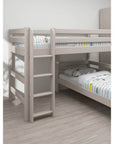 Grey bunk bed with straight ladder and safety rails, designed for children's rooms, featuring modern striped bedding.