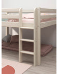 High bed with safety rail and straight ladder, anti-slip steps, and cozy under-bed area for storage and play.