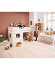 High bed with treehouse design, children playing, and a cozy room for imaginative play, featuring white and oak finishes.