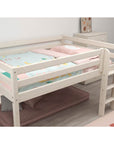 High bed with safety rail and ladder, designed for comfort and space-saving, featuring pink and turquoise bedding.