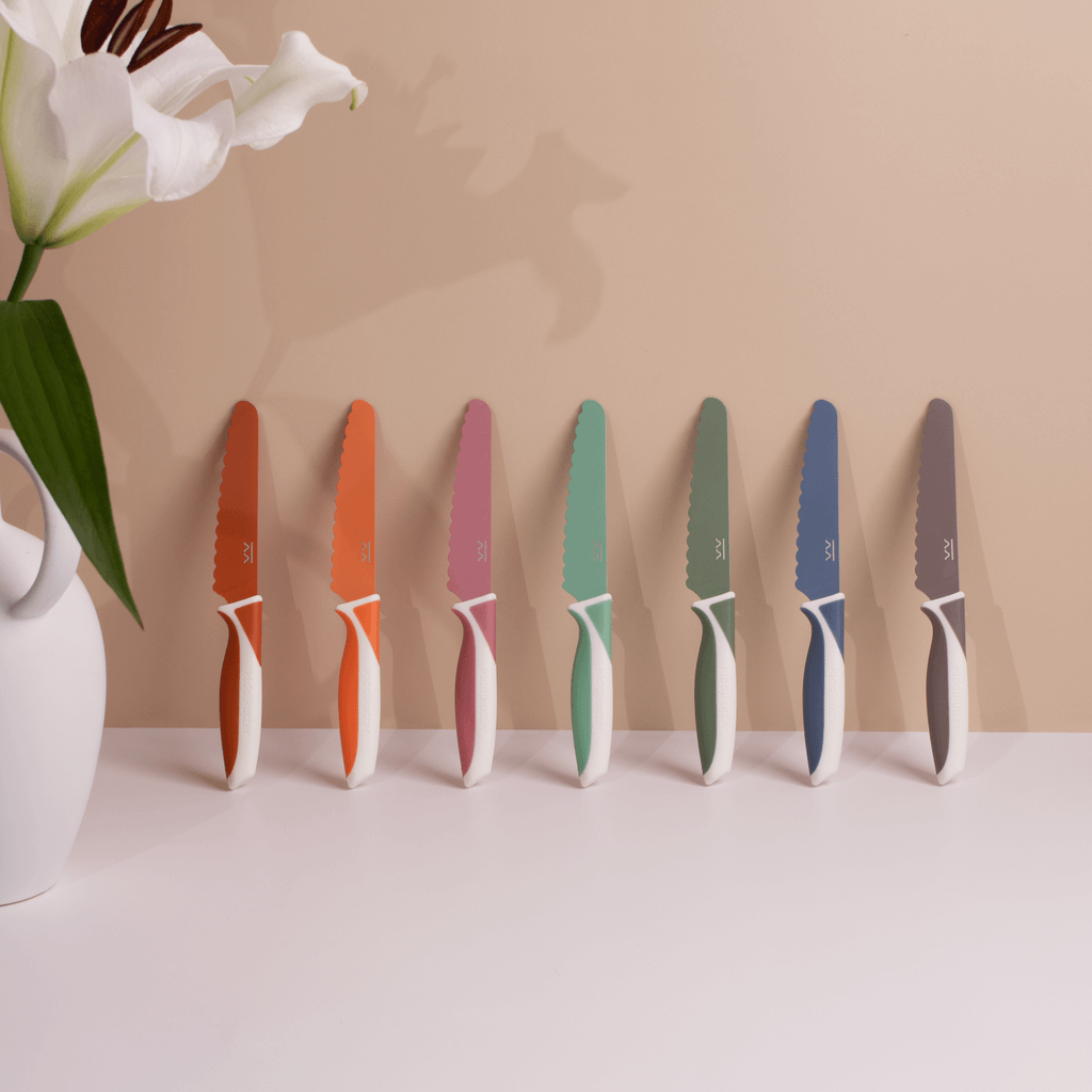 KiddiKutter Knife - Blueberry and colorful safe knives for kids cooking displayed in a modern kitchen setting.