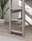 Close-up of a sturdy wooden ladder for a bunk bed, showcasing its safety features and sleek grey design.